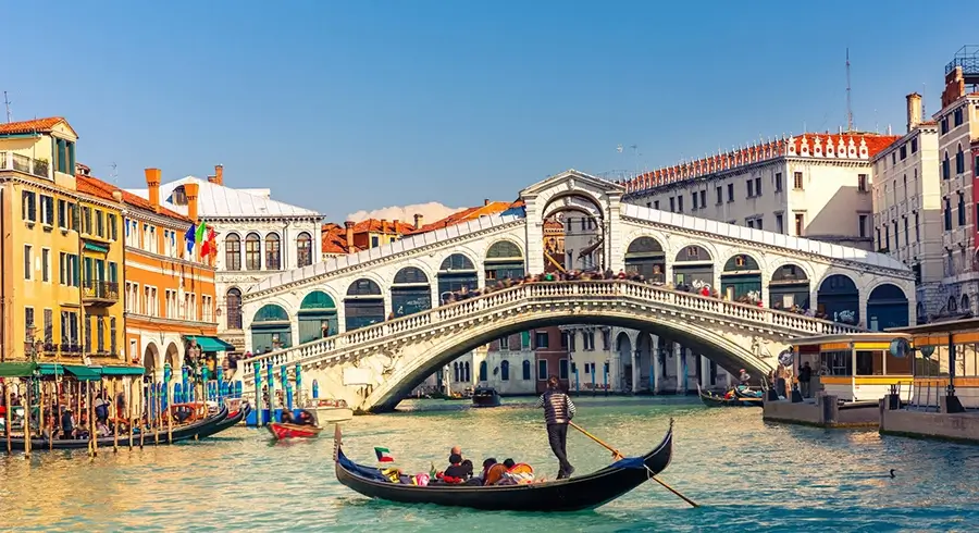 Rialto Bridge is a stone arch bridge over a Grand Canal in Venice, Italy.