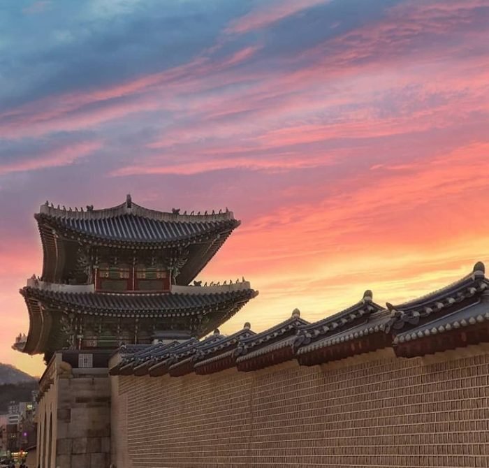 Seoul skyline with Gyeongbokgung Palace at sunset