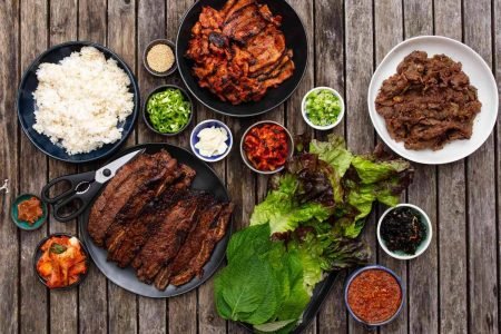 Taste Authentic Korean BBQ – A must-do dining experience with grilled meats and side dishes.