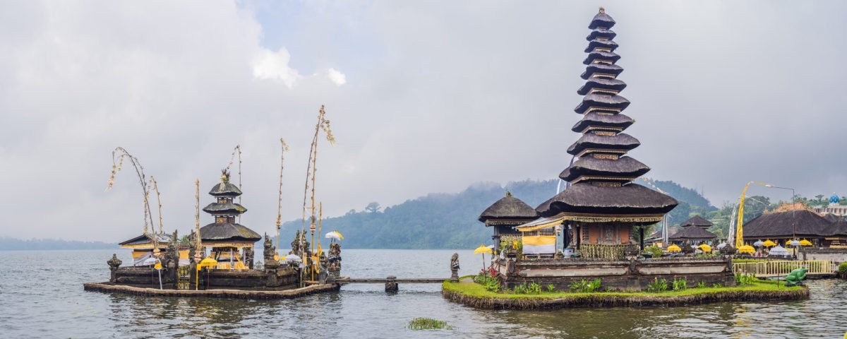 Pura Ulun Danu Bratan, Bali. Hindu temple surrounded by flowers on Bratan lake, Bali. Major Shivaite water temple in Bali, Indonesia. Hindu temple.