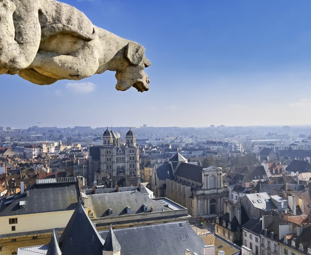 View of gargoyle on the top of city hall of Dijon, France